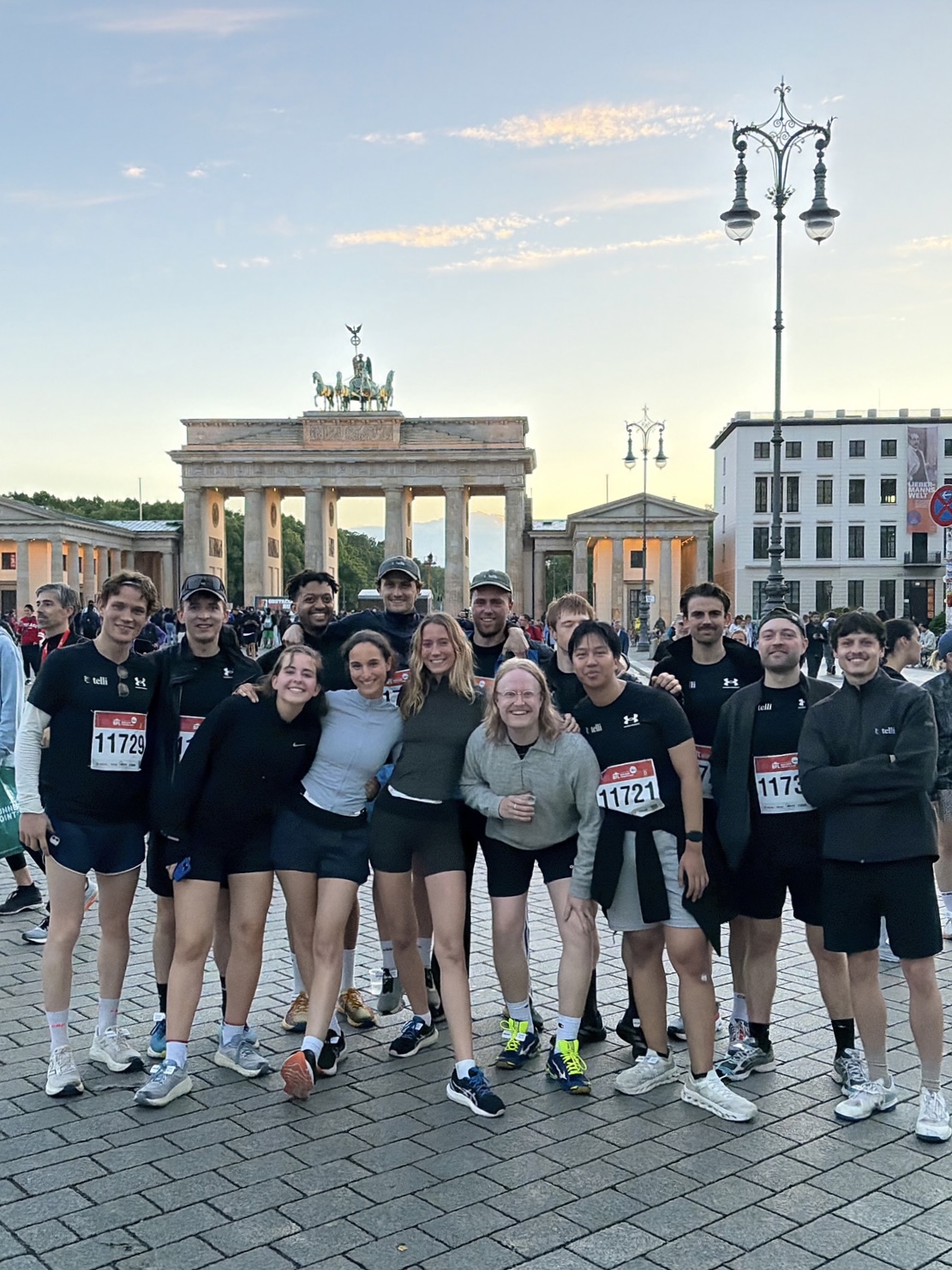 Team at the Brandenburg Gate after a run
